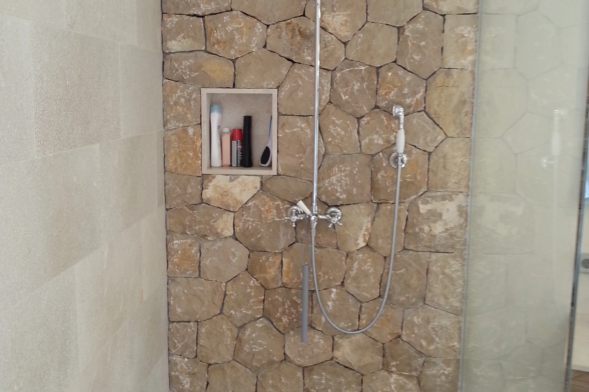 Architect Mallorca finca rustica  spacious bathroom with glass shower and quarry stone, Es Raiguer 2